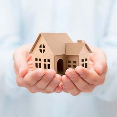 house3 photo of small model of a house being held in the palms of someone's hands