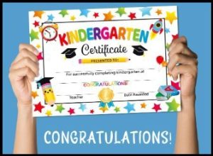 photo of hands holding up a colorful certificate that says Kindergarten Certificate with the word Congratulations underneath